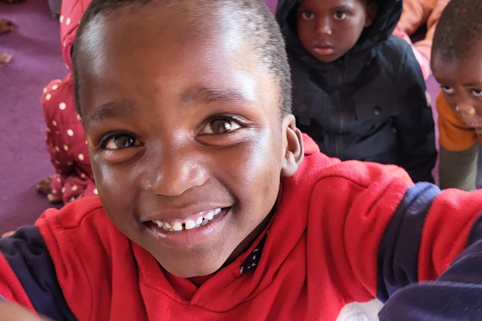Sawabona Africa Film into image of a smiling boy
